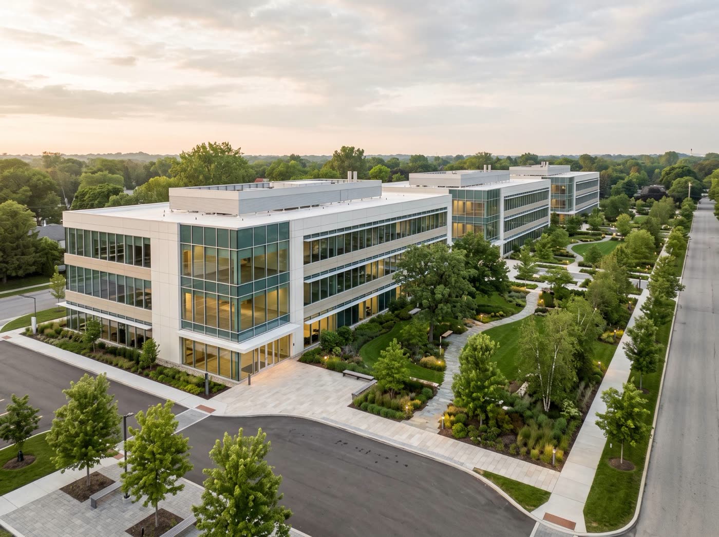 Office campus of three low buildings with landscaped courtyards